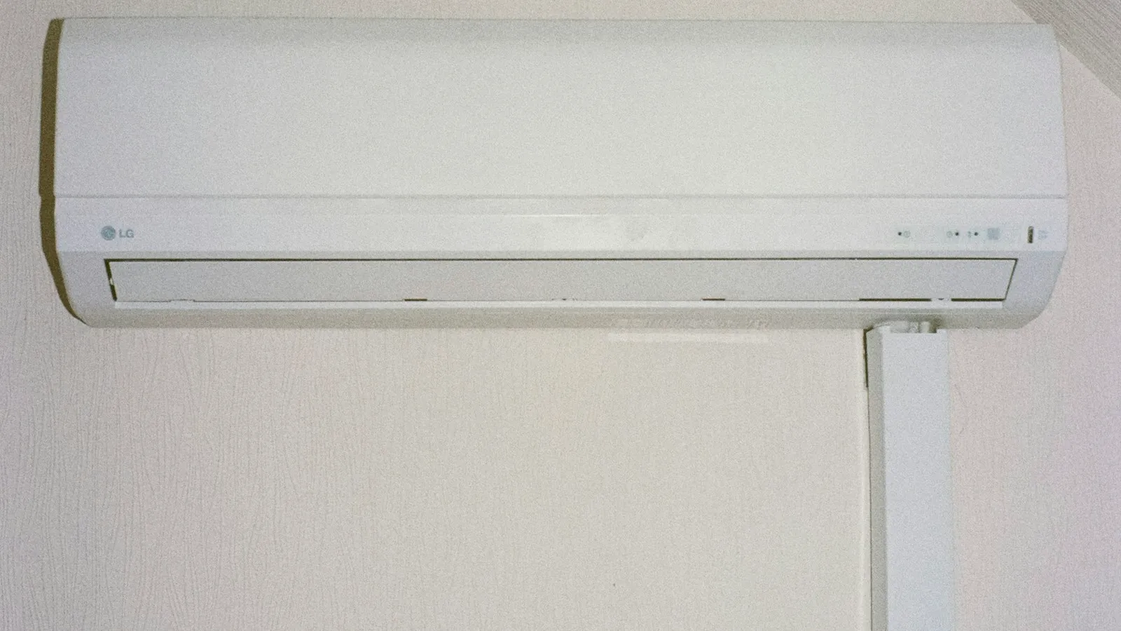White wall-mounted air conditioner indoors