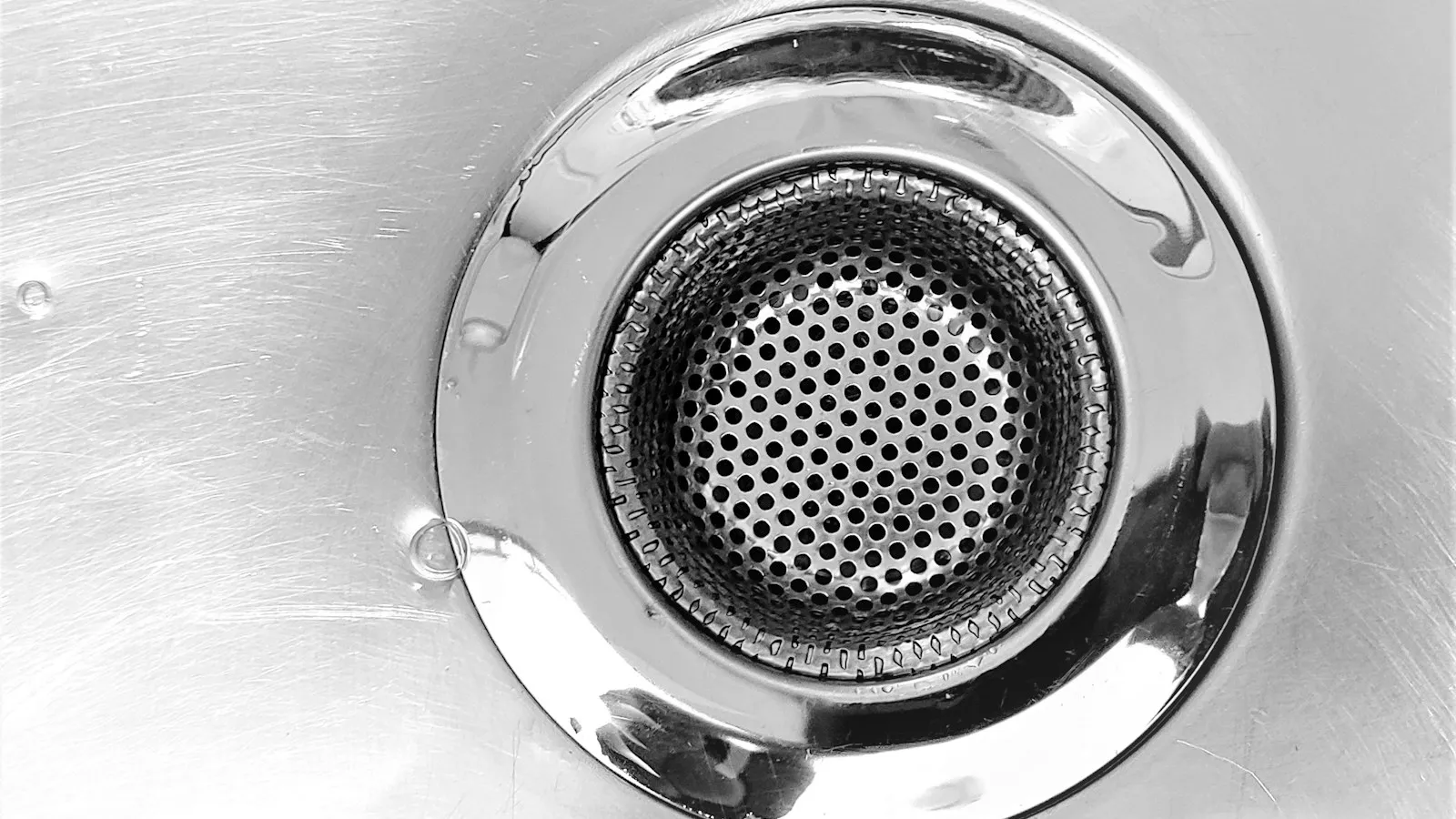 Close-up of a metal sink drain strainer